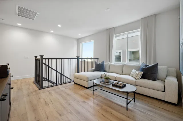 a spacious bathroom with a double vanity sink and a mirror