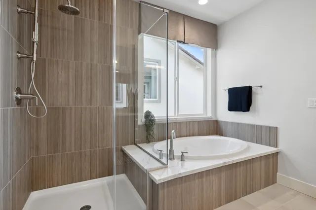 a bedroom with a bed and a mirror