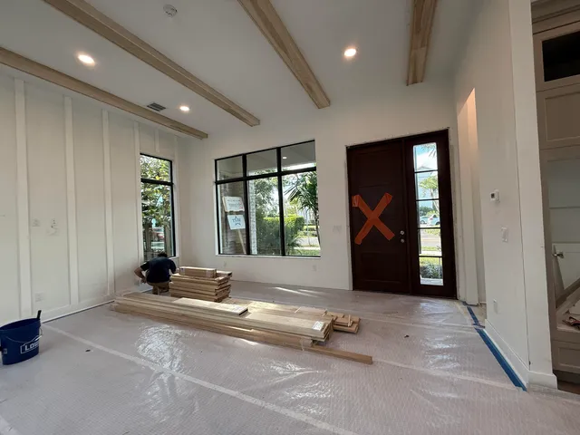 a view of a room with a large window and couch