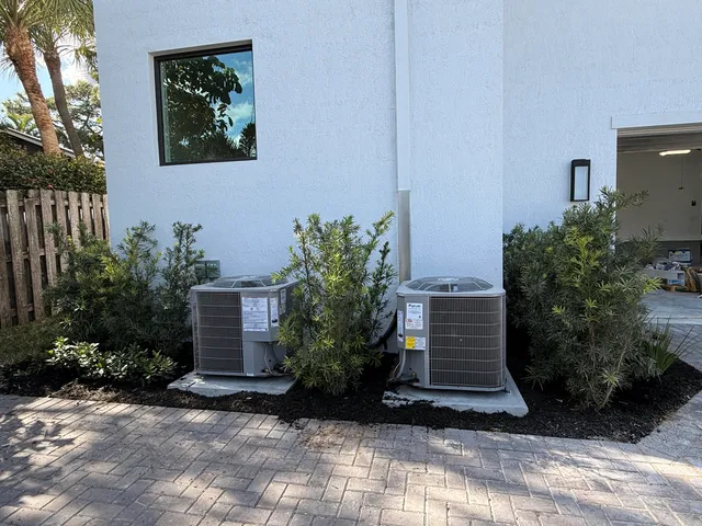 a view of a lake with boats and palm trees
