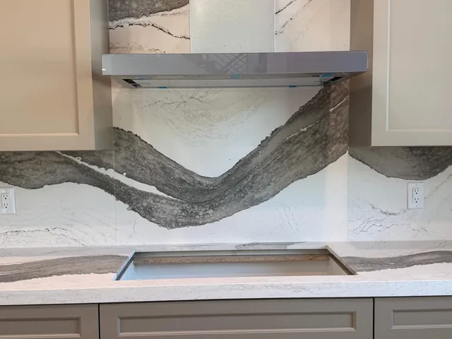 a stove top oven sitting inside of a kitchen