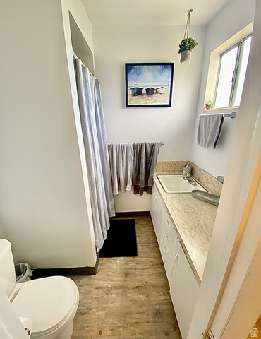 620 East 600 North Logan, UT 84321 - Photo 8 of 13 Full bath featuring vanity, a shower with curtain, and light wood-style flooring