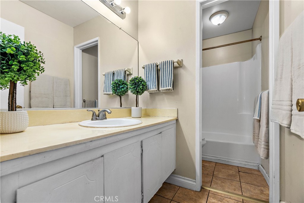 1386 3rd Street Duarte, CA 91010 - Photo 14 of 30 a bathroom with a sink and a mirror