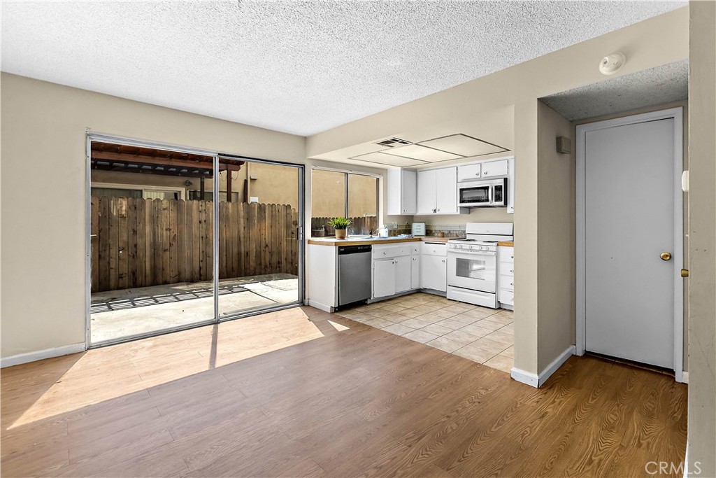 1386 3rd Street Duarte, CA 91010 - Photo 2 of 30 a view of a kitchen with a sink and a stove top oven