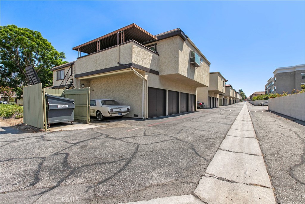 1386 3rd Street Duarte, CA 91010 - Photo 22 of 30 a car parked in front of a white house