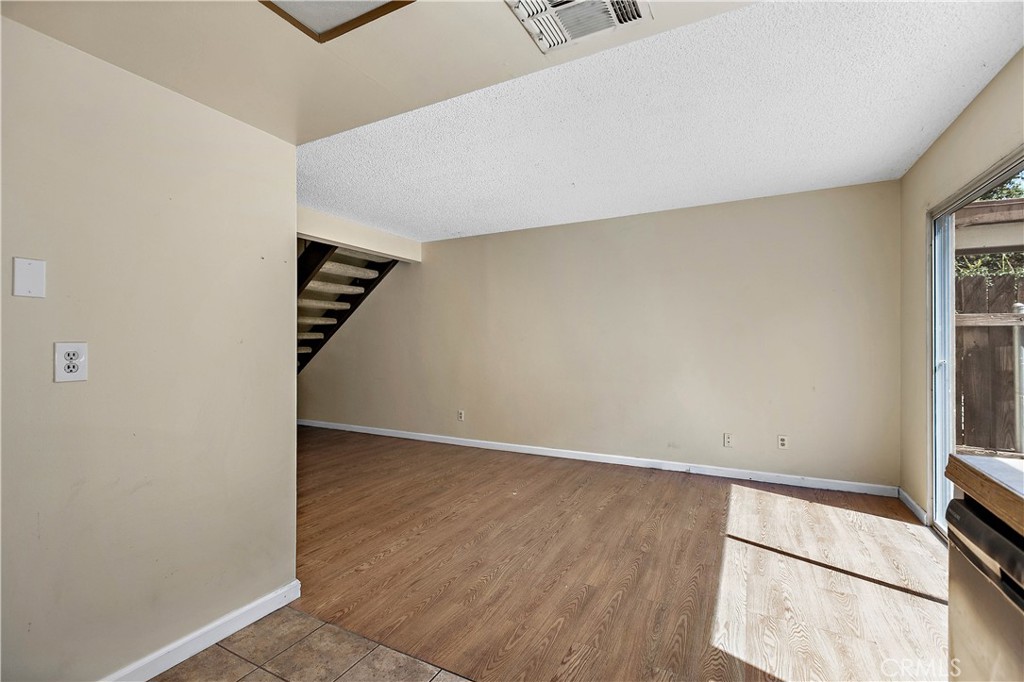 1386 3rd Street Duarte, CA 91010 - Photo 8 of 30 an empty room with wooden floor