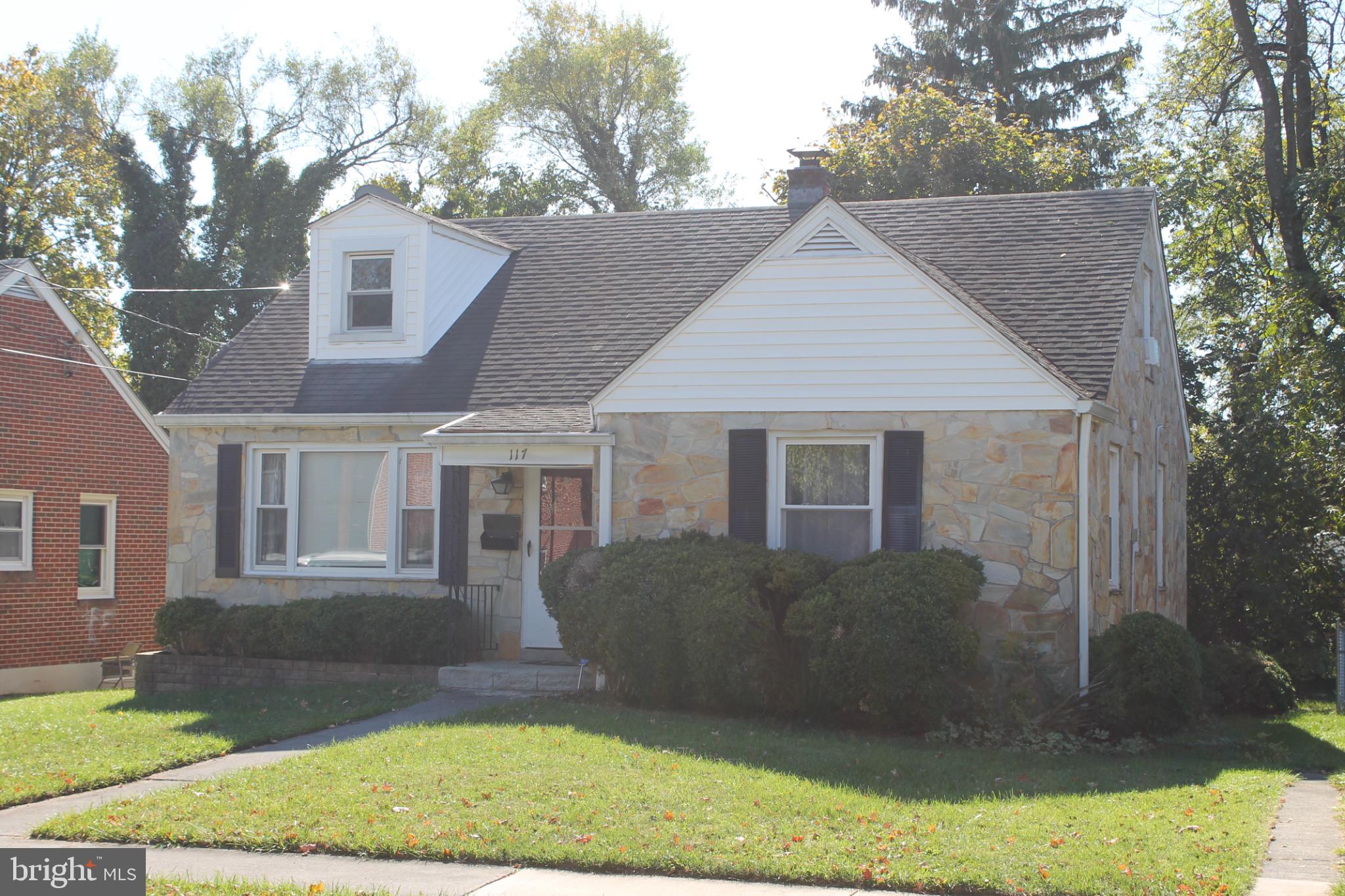 a view of a yard in front view of a house