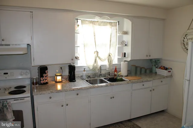 a kitchen with a sink and cabinets