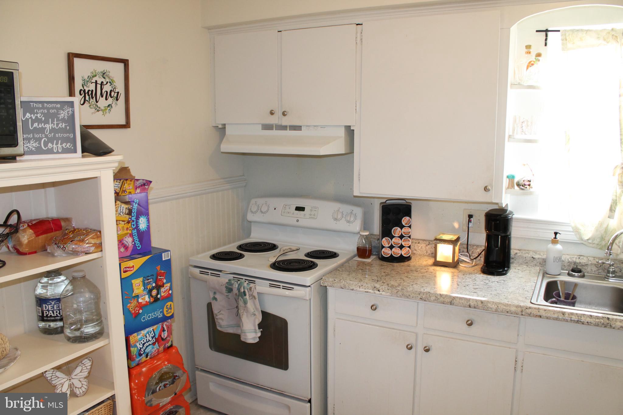 117 West Oates Avenue Winchester, VA 22601 - Photo 13 of 17 a kitchen with a stove and cabinets