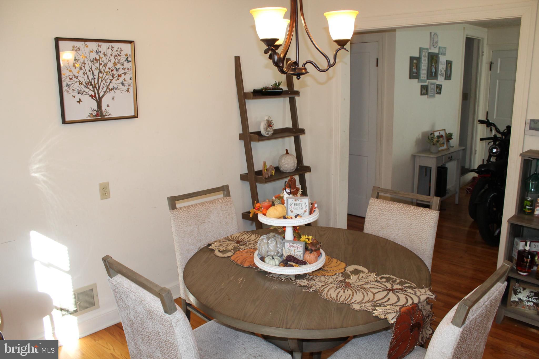 117 West Oates Avenue Winchester, VA 22601 - Photo 7 of 17 a dining room with furniture and wooden floor