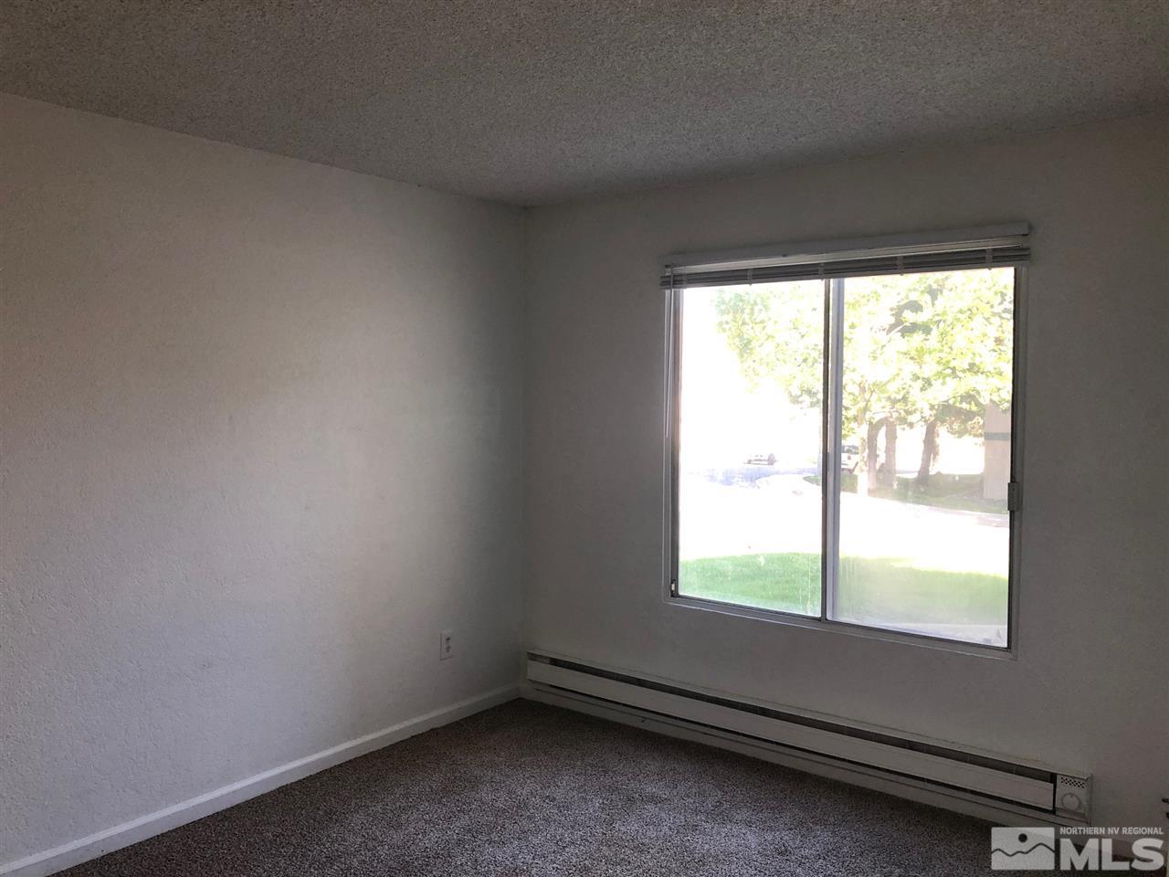 3942 Clear Acre Lane Reno, NV 89512 - Photo 12 of 24 a view of an empty room with a window