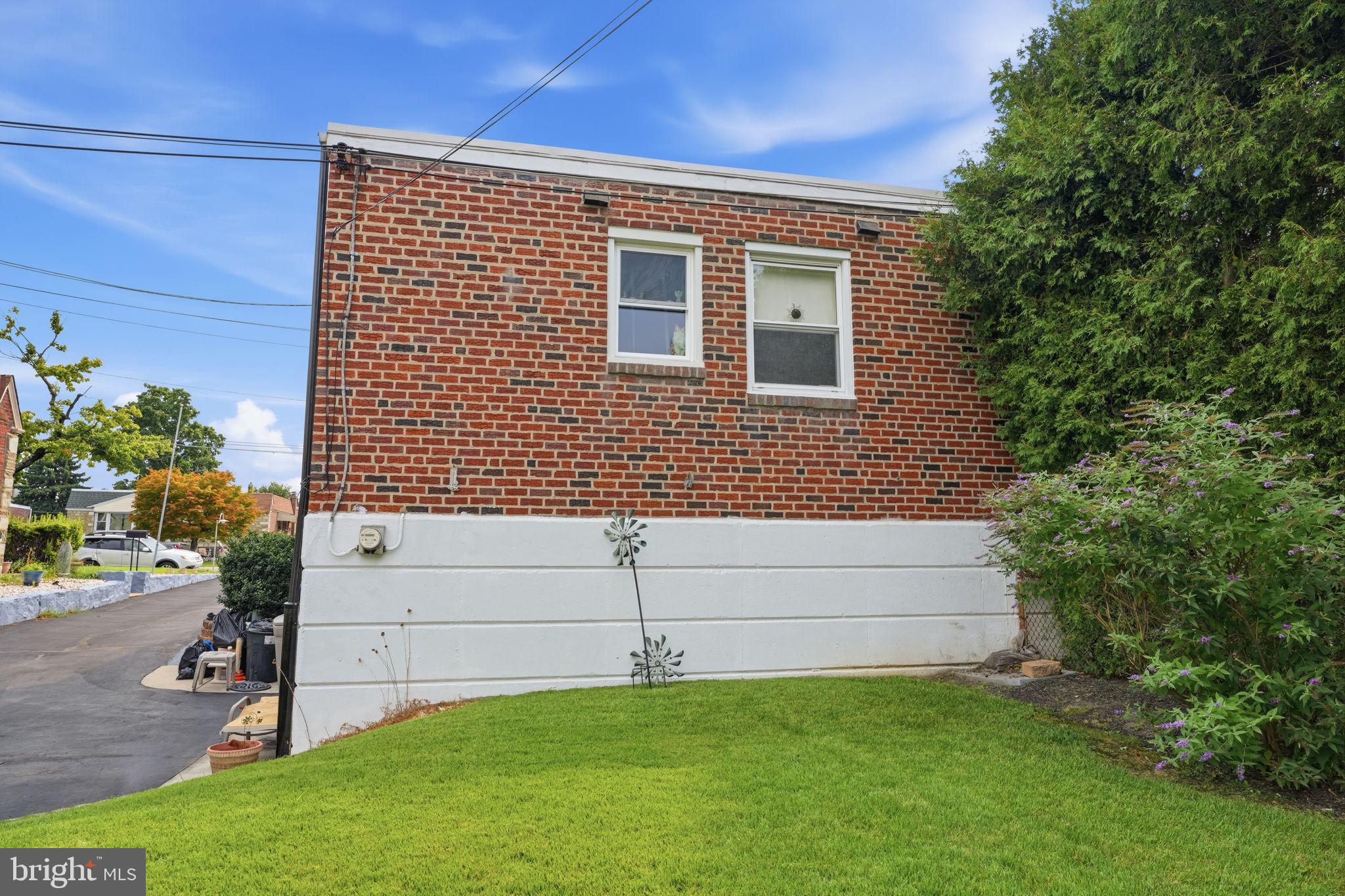2012 Tomlinson Road Philadelphia, PA 19116 - Photo 30 of 33 Charming brick home with lush greenery.