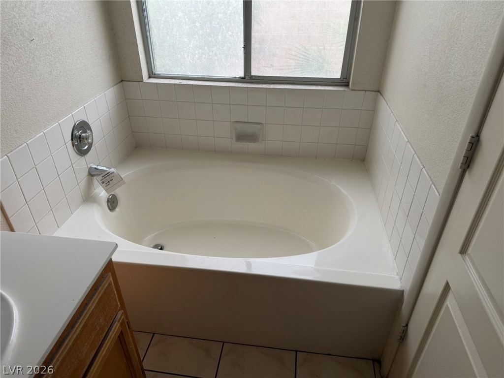 277 Gentle Bay Avenue Henderson, NV 89074 - Photo 30 of 43 Relax and unwind in this inviting primary bathroom, featuring a deep soaking tub.