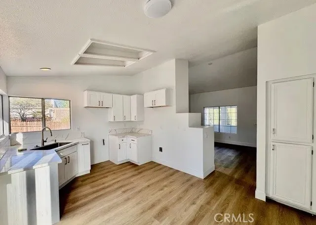 a bed room with a bed and wooden floor
