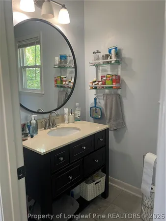 a bathroom with a shower curtain and a curtain