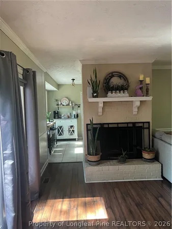 a view of a kitchen with fridge and window