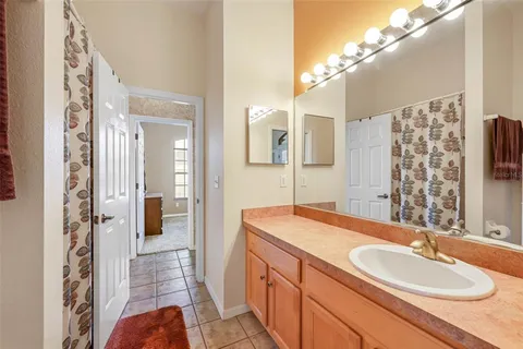 a en suite bathroom with a sink and a mirror