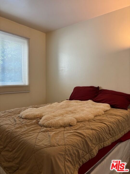 1119 Albany Street, Unit 241 Los Angeles, CA 90015 - Photo 11 of 21 a bedroom with a bed and a window