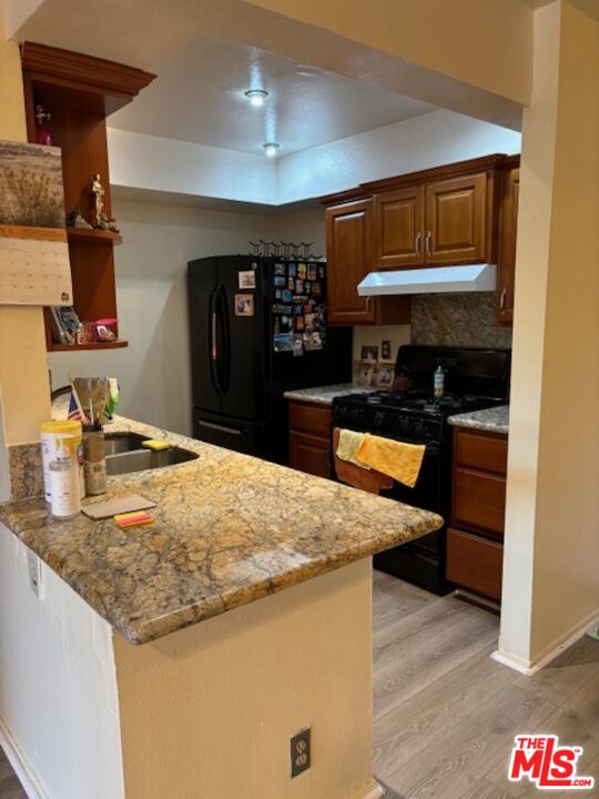 1119 Albany Street, Unit 241 Los Angeles, CA 90015 - Photo 13 of 21 a kitchen with stainless steel appliances granite countertop a sink and a stove