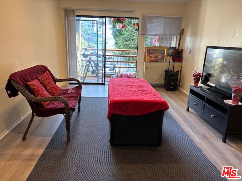 1119 Albany Street, Unit 241 Los Angeles, CA 90015 - Photo 16 of 21 a room with furniture and a flat screen tv