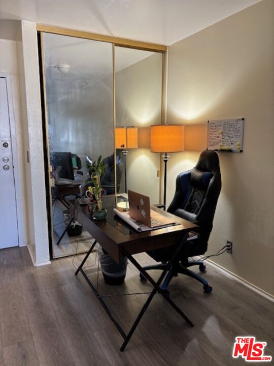 1119 Albany Street, Unit 241 Los Angeles, CA 90015 - Photo 19 of 21 a workspace with furniture and wooden floor