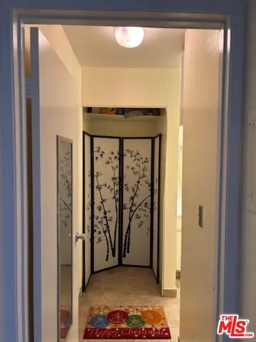 a view of hallway with wooden floor