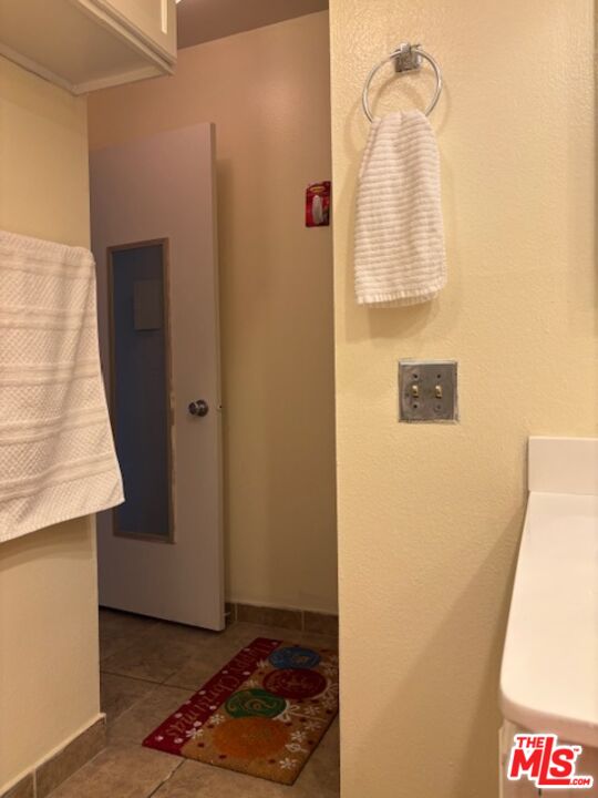 1119 Albany Street, Unit 241 Los Angeles, CA 90015 - Photo 7 of 21 a bathroom with a sink and a mirror