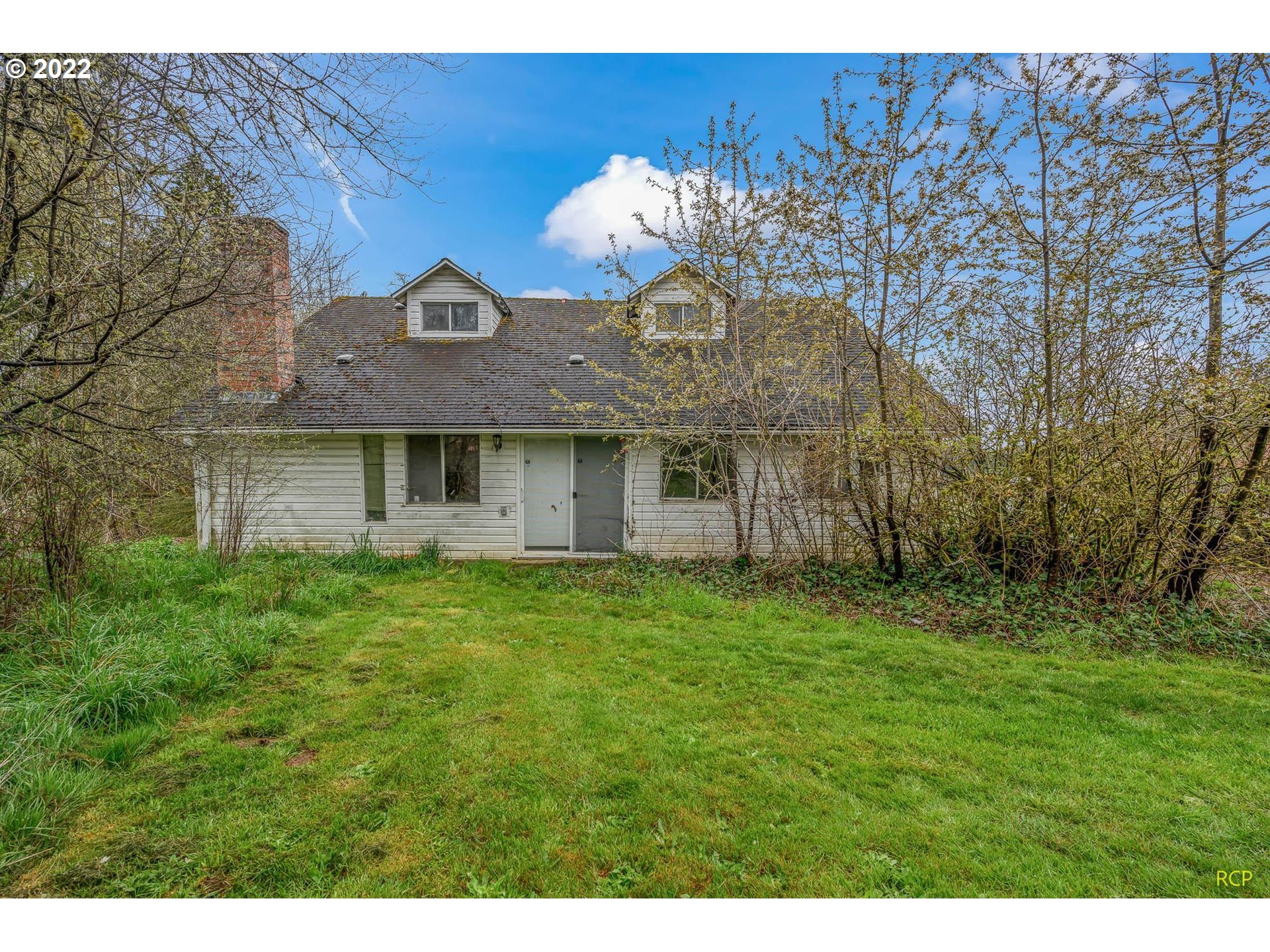 24596 Mosier Road Rainier, OR 97048 - Photo 3 of 32 a view of a house with a backyard