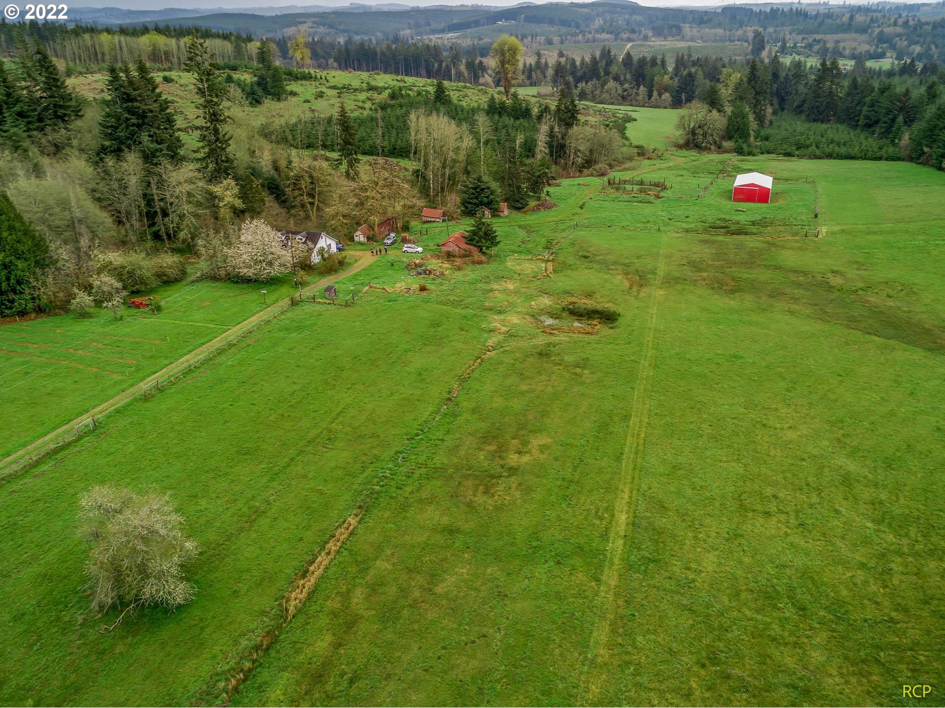 24596 Mosier Road Rainier, OR 97048 - Photo 4 of 32 a view of a green field with an outdoor space