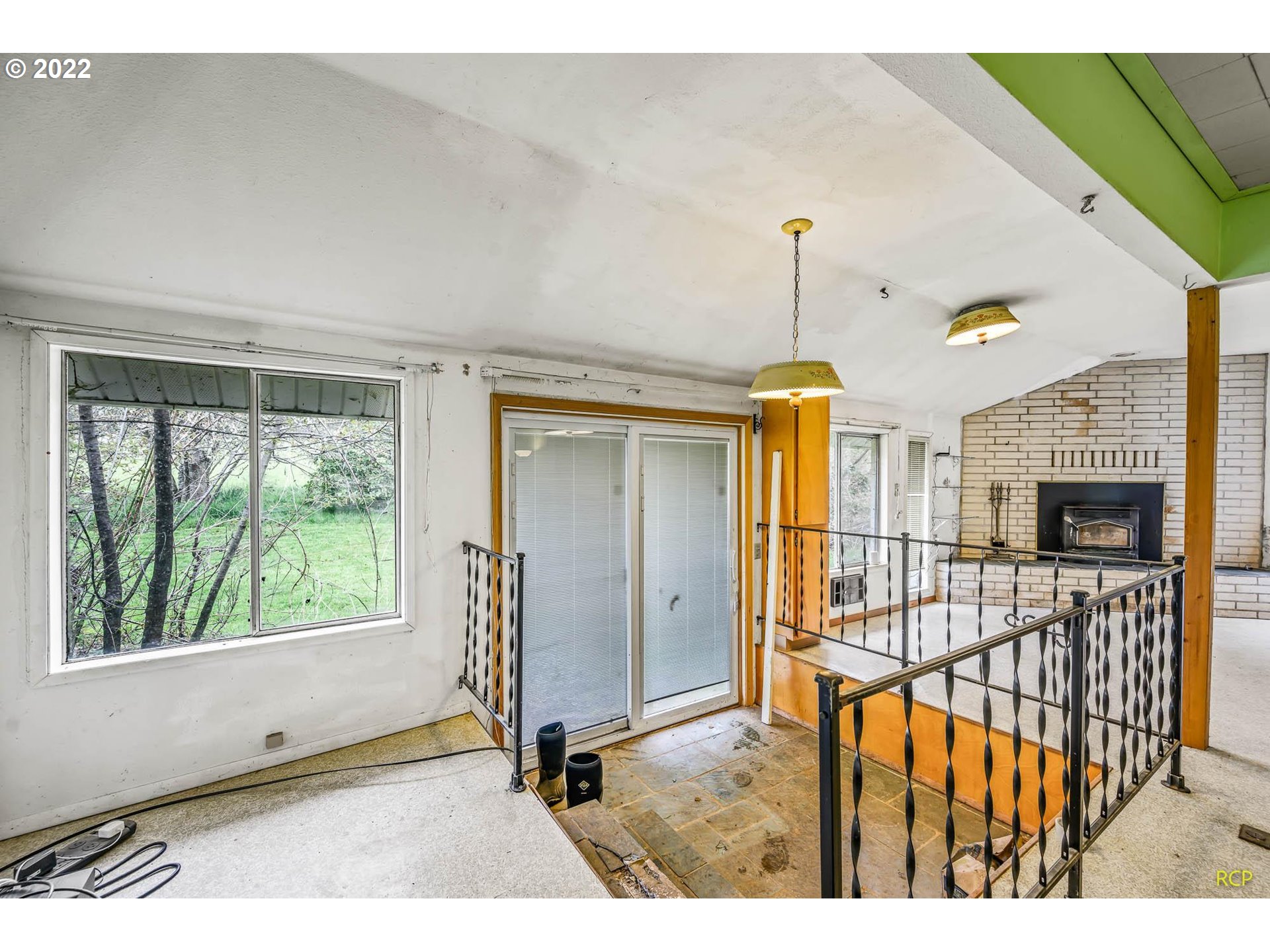 24596 Mosier Road Rainier, OR 97048 - Photo 10 of 32 a view of a room with wooden floor windows and entryway