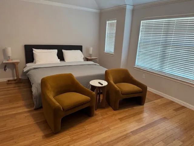 a bedroom with a bed and a couch