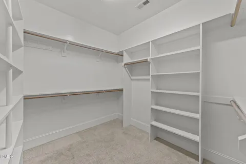 a bathroom with a granite countertop sink two mirror and a