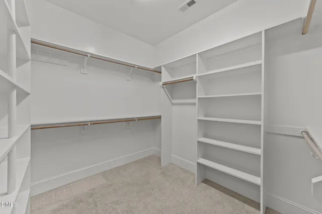 a bathroom with a granite countertop sink two mirror and a