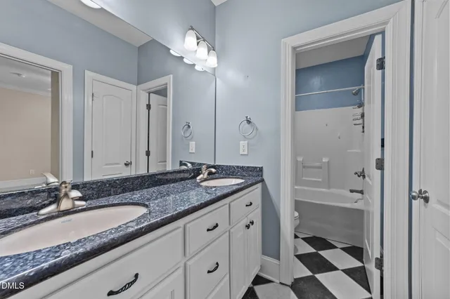 a view of an empty room with a ceiling fan