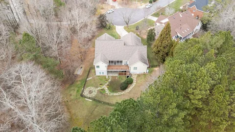 an aerial view of a house with outdoor space