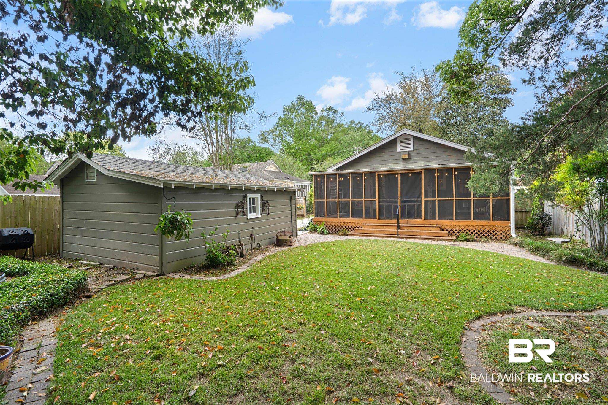 165 South Fulton Street Mobile, AL 36606 - Photo 20 of 24 Rear view of property featuring a fenced backyard and a sunroom