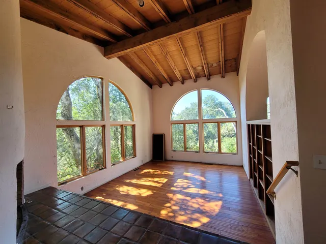 a view of empty room with windows