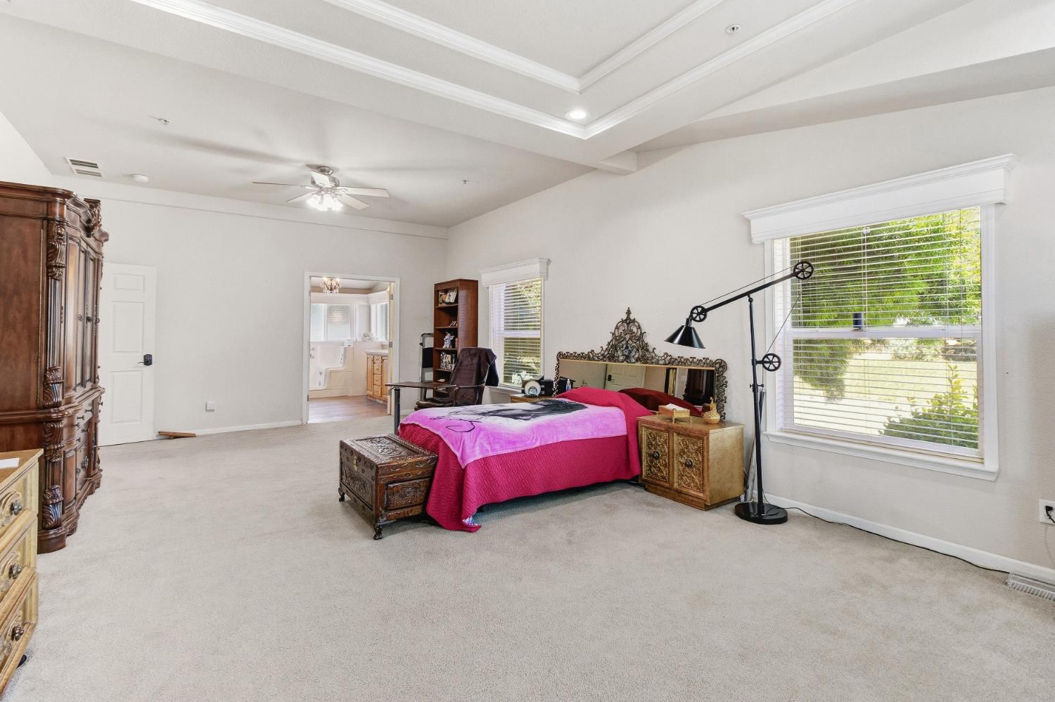 12390 Hobday Road Wilton, CA 95693 - Photo 29 of 92 a spacious bedroom with a bed and a window