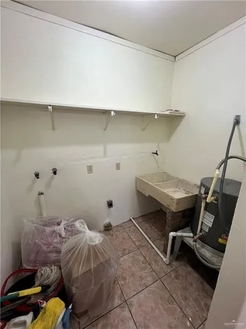 a bedroom with a bed and a desk