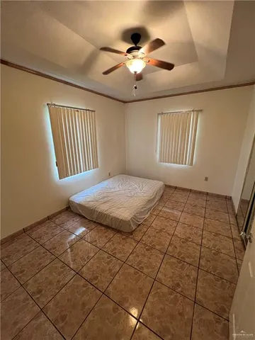 a view of a livingroom with a ceiling fan and window