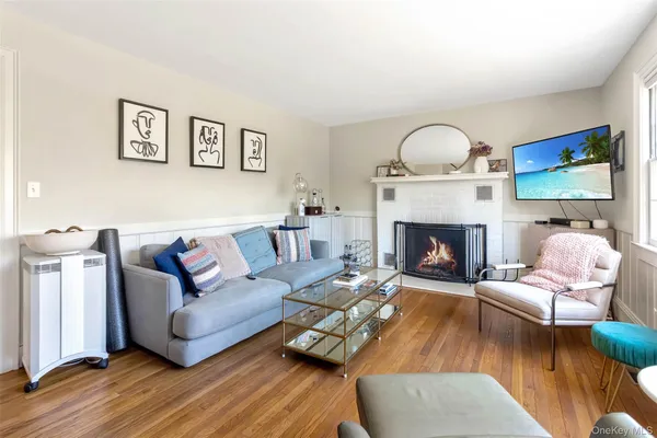 a living room with furniture fireplace and a fireplace