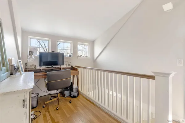 a workspace with furniture and a window