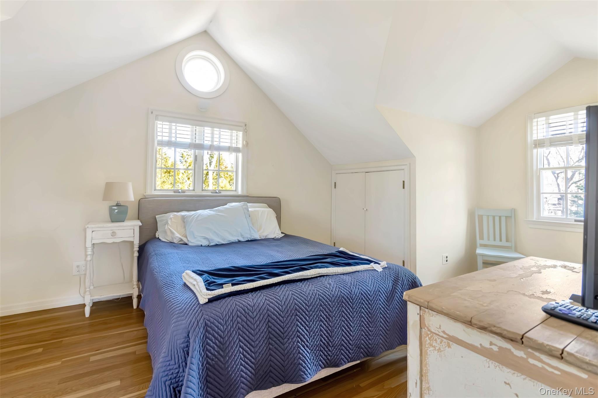 1500 Vanston Road Cutchogue, NY 11935 - Photo 20 of 26 Bedroom featuring lofted ceiling, wood finished floors, and baseboards