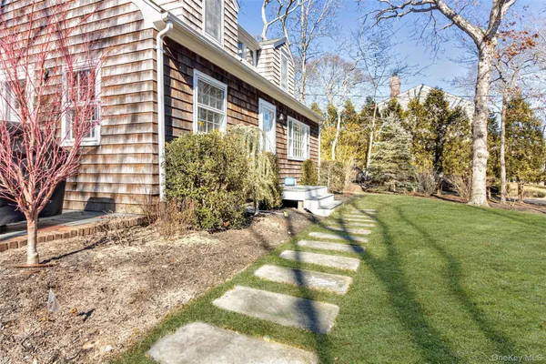 a view of house with yard
