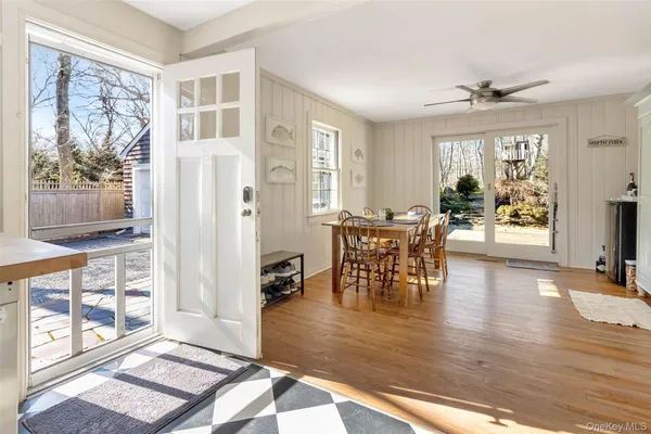 a view of a livingroom kitchen and dining room with wooden floor
