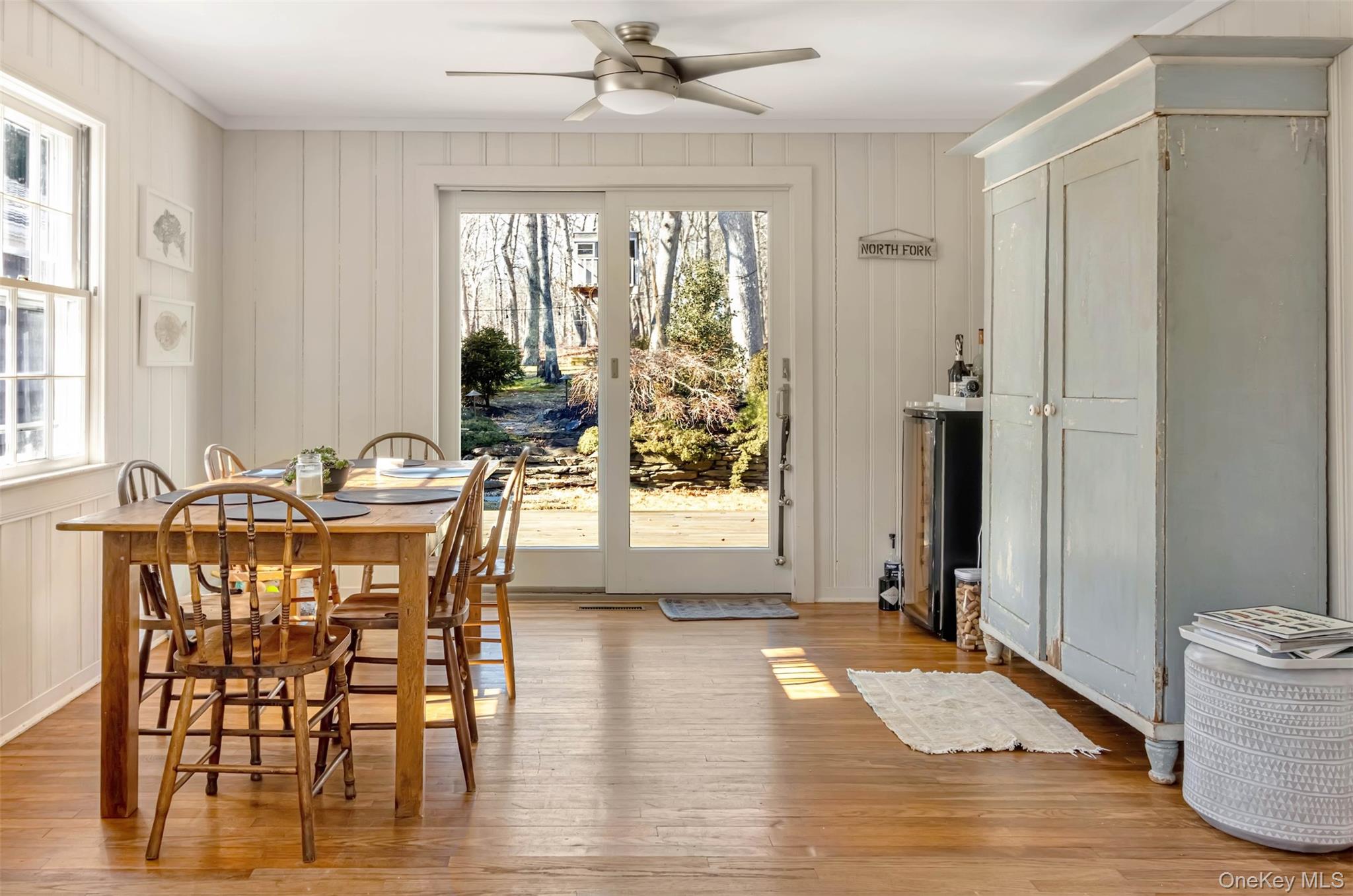1500 Vanston Road Cutchogue, NY 11935 - Photo 8 of 26 Dining area with crown molding, plenty of natural light, light wood finished floors, and a ceiling fan