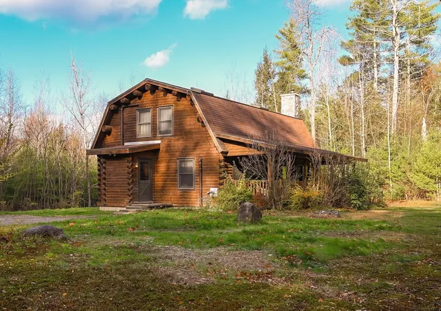 a view of a big house with a yard