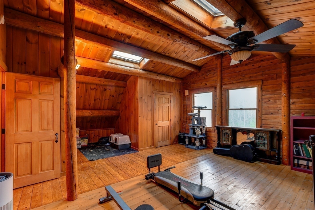 23 Dana Road Petersham, MA 01366 - Photo 20 of 32 a living room with furniture gym equipment and a window
