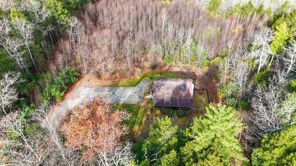 23 Dana Road Petersham, MA 01366 - Photo 27 of 32 a backyard of a house with a yard and outdoor seating