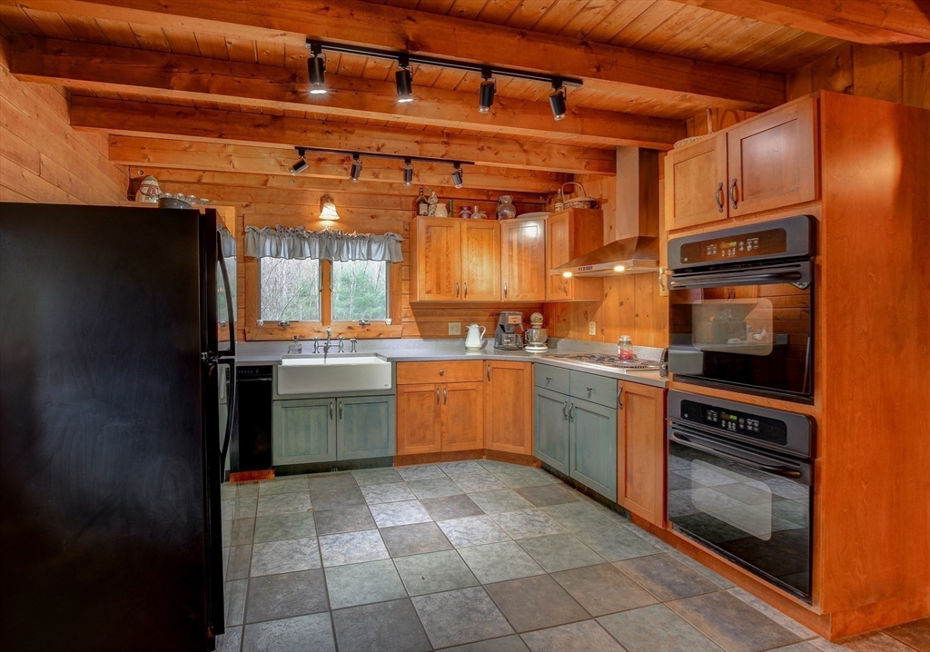 23 Dana Road Petersham, MA 01366 - Photo 4 of 32 a kitchen with a sink cabinets and stainless steel appliances
